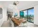 Bright dining area with modern chandelier and panoramic ocean views at 100 6Th S St, Bradenton Beach, FL 34217