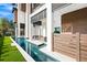 Modern home exterior with a pool feature and manicured lawn at 100 6Th S St, Bradenton Beach, FL 34217