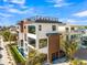 Contemporary home boasting a rooftop deck, pool, and sleek design near the shore at 100 6Th S St, Bradenton Beach, FL 34217