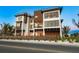 Beautiful modern home with multi-level balconies, large windows, and stylish architectural details at 100 6Th S St, Bradenton Beach, FL 34217