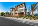 Striking two-story home boasting a modern design, big windows, and meticulously maintained landscaping at 100 6Th S St, Bradenton Beach, FL 34217