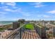 Modern rooftop deck with artificial grass and ocean view, complemented by sleek railings and inviting outdoor space at 100 6Th S St, Bradenton Beach, FL 34217