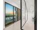 Bright hallway with a wall of windows overlooking the ocean and modern décor at 100 6Th S St, Bradenton Beach, FL 34217