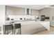 Sleek modern kitchen with stainless steel appliances, quartz countertops, and minimalist cabinetry at 100 6Th S St, Bradenton Beach, FL 34217