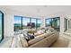 Spacious living room with floor-to-ceiling windows offering stunning ocean views at 100 6Th S St, Bradenton Beach, FL 34217