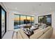 Bright living room with modern furnishings, sleek design, and a panoramic ocean view from large windows, offering serene coastal living at 100 6Th S St, Bradenton Beach, FL 34217