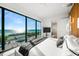 This main bedroom features ocean views, minimalist decor, and a large viewing window at 100 6Th S St, Bradenton Beach, FL 34217