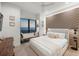 Cozy bedroom with an ocean view, a comfortable bed, and stylish décor, creating a serene and inviting retreat at 100 6Th S St, Bradenton Beach, FL 34217