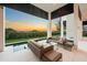 Elegant patio with comfortable seating and a tranquil view of the sunset at 100 6Th S St, Bradenton Beach, FL 34217
