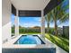 A modern, cozy pool area with seating, offering a private and relaxing retreat at 100 6Th S St, Bradenton Beach, FL 34217