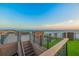 Stunning rooftop deck with ocean views and outdoor seating area, perfect for entertaining or relaxing at 100 6Th S St, Bradenton Beach, FL 34217