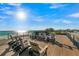 Expansive rooftop deck with comfortable lounge seating boasting panoramic ocean views at 100 6Th S St, Bradenton Beach, FL 34217