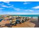 Stunning rooftop deck with lounge seating overlooking the beach and ocean views at 100 6Th S St, Bradenton Beach, FL 34217