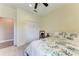 Bright and airy bedroom with a floral comforter, closet, and wood-look flooring at 1219 Thornbury Dr, Parrish, FL 34219