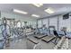 Well-equipped fitness center with treadmills, weights, and mirrored walls for a complete workout at 1219 Thornbury Dr, Parrish, FL 34219