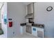 Outdoor grilling area equipped with a stainless steel grill, sink, and storage in the community at 1219 Thornbury Dr, Parrish, FL 34219
