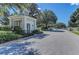 Charming guardhouse entrance with lush landscaping, providing secure access to the community at 1219 Thornbury Dr, Parrish, FL 34219