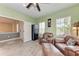 Inviting living room with wood-look floors, two comfortable armchairs, and classic decor at 1219 Thornbury Dr, Parrish, FL 34219
