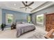 Main bedroom features tray ceiling, ceiling fan, two windows for natural light, and ample space at 1219 Thornbury Dr, Parrish, FL 34219