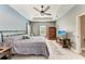 Spacious main bedroom with tray ceiling, ceiling fan, natural light, and ample space for a relaxing retreat at 1219 Thornbury Dr, Parrish, FL 34219