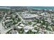 Aerial view showcasing the property's proximity to the bay and cityscape with lush green landscape at 130 N Adams Dr, Sarasota, FL 34236