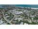 Breathtaking aerial view showcasing coastal real estate, sandy beaches, and the stunning waterfront skyline at 130 N Adams Dr, Sarasota, FL 34236