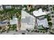 Aerial view showcasing home's layout, driveway, landscaping and proximity to nearby houses at 130 N Adams Dr, Sarasota, FL 34236