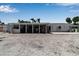 The backyard features an expansive screened porch, plenty of space, and potential for outdoor enjoyment at 130 N Adams Dr, Sarasota, FL 34236
