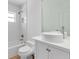 This bathroom features modern fixtures, a vessel sink, and shower/tub combo at 130 N Adams Dr, Sarasota, FL 34236
