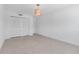 Bedroom features neutral colored floor, white walls, and a storage closet at 130 N Adams Dr, Sarasota, FL 34236
