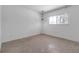 Well-lit bedroom featuring a window with natural light at 130 N Adams Dr, Sarasota, FL 34236