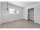 Bright bedroom with a window, featuring a closet with sliding doors at 130 N Adams Dr, Sarasota, FL 34236