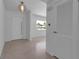 Inviting entryway with modern door, stylish light fixture, polished floors, and neutral color palette create a welcoming ambiance at 130 N Adams Dr, Sarasota, FL 34236