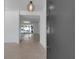 Bright entryway showcasing neutral tones, terrazzo floors, and large sliders to the outdoor patio at 130 N Adams Dr, Sarasota, FL 34236