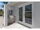 The entrance includes a small desk and a double door and a quaint sitting area at 130 N Adams Dr, Sarasota, FL 34236