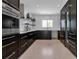 Modern kitchen featuring custom cabinets, stainless steel appliances, and ample counter space at 130 N Adams Dr, Sarasota, FL 34236