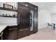 Gourmet kitchen features built in wine fridge, custom cabinets, and ample counter space at 130 N Adams Dr, Sarasota, FL 34236