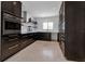 Modern kitchen featuring custom cabinets, stainless steel appliances, and ample counter space at 130 N Adams Dr, Sarasota, FL 34236