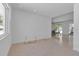 Minimalist living area featuring terrazzo floors and large windows at 130 N Adams Dr, Sarasota, FL 34236