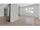 Bright living room with tile floors, large window, and ample natural light at 130 N Adams Dr, Sarasota, FL 34236