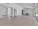 Bright and airy living space with modern lighting, dining area, polished floors, and open layout perfect for entertaining at 130 N Adams Dr, Sarasota, FL 34236