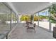 Inviting outdoor space with sleek dining table, chairs, full outdoor kitchen at 130 N Adams Dr, Sarasota, FL 34236