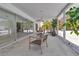 Inviting outdoor space with sleek dining table, chairs, full outdoor kitchen at 130 N Adams Dr, Sarasota, FL 34236