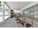Enclosed patio with dining area, chairs and outdoor kitchen at 130 N Adams Dr, Sarasota, FL 34236