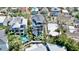Aerial view of luxurious home with pool, lush landscaping, and multi-level balconies at 135 Avenida Veneccia, Sarasota, FL 34242