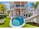 Backyard oasis featuring a pool, slide, and spacious outdoor lounging areas at 135 Avenida Veneccia, Sarasota, FL 34242
