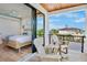 Balcony with seating offers beautiful views, blending indoor comfort with outdoor serenity and style at 135 Avenida Veneccia, Sarasota, FL 34242
