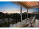 Spacious covered balcony with comfortable seating offers serene sunset views and outdoor living space at 135 Avenida Veneccia, Sarasota, FL 34242