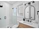 Sleek bathroom with a glass-enclosed shower, modern fixtures, and elegant finishes at 135 Avenida Veneccia, Sarasota, FL 34242