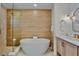 Luxurious bathroom with soaking tub, walk-in shower, and elegant fixtures at 135 Avenida Veneccia, Sarasota, FL 34242